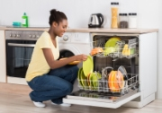 woman emptying dishwasher